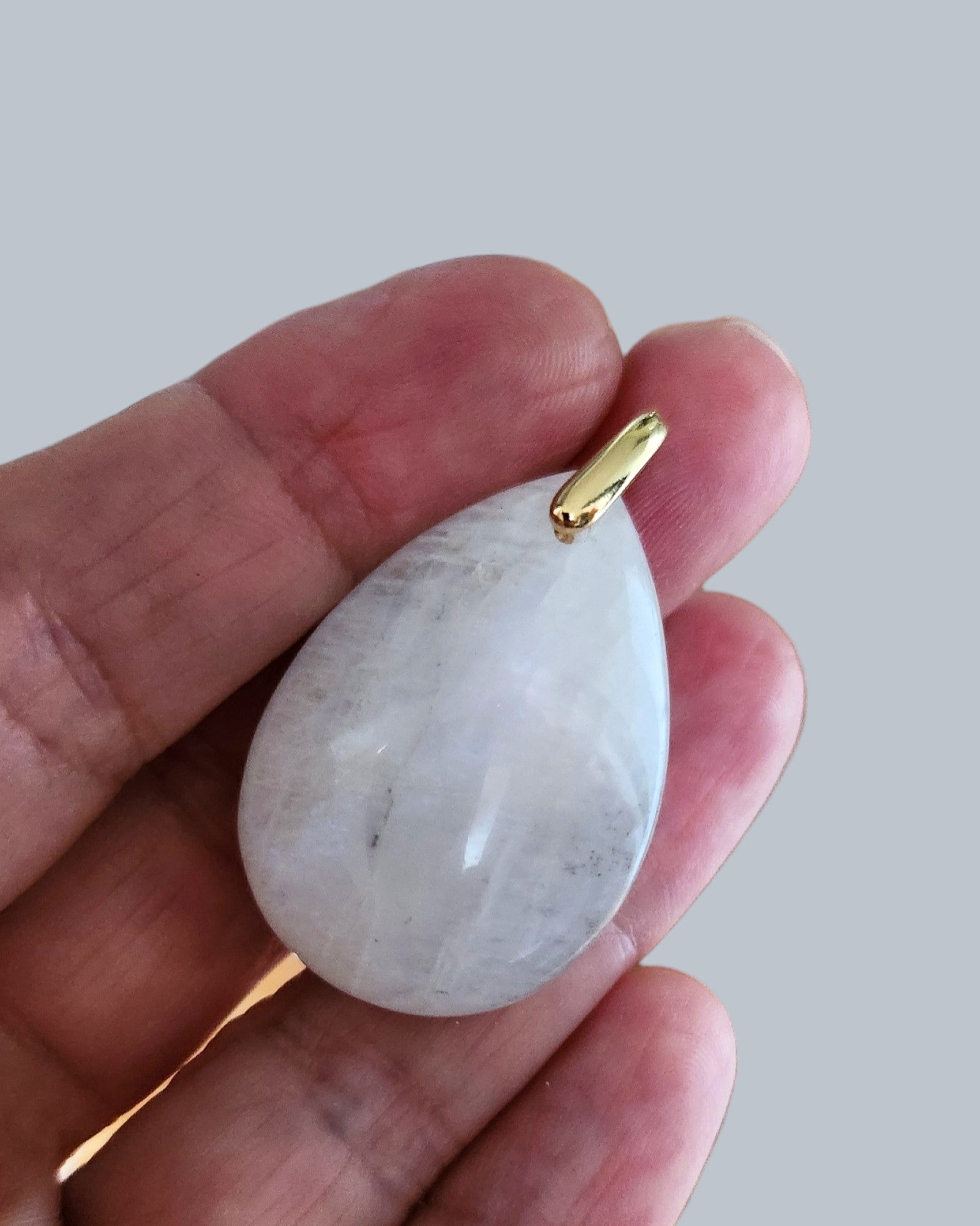 Pendentif en pierre de lune blanche, rosée ou orangée